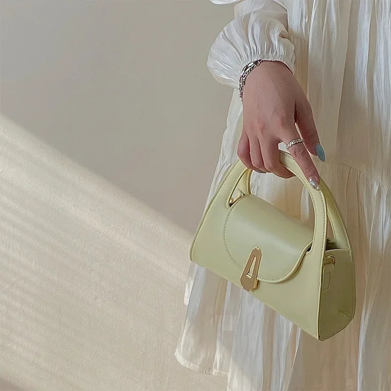 Niche high-end handbag women's new semi-round shoulder bag versatile commuter retro lock messenger bag tide