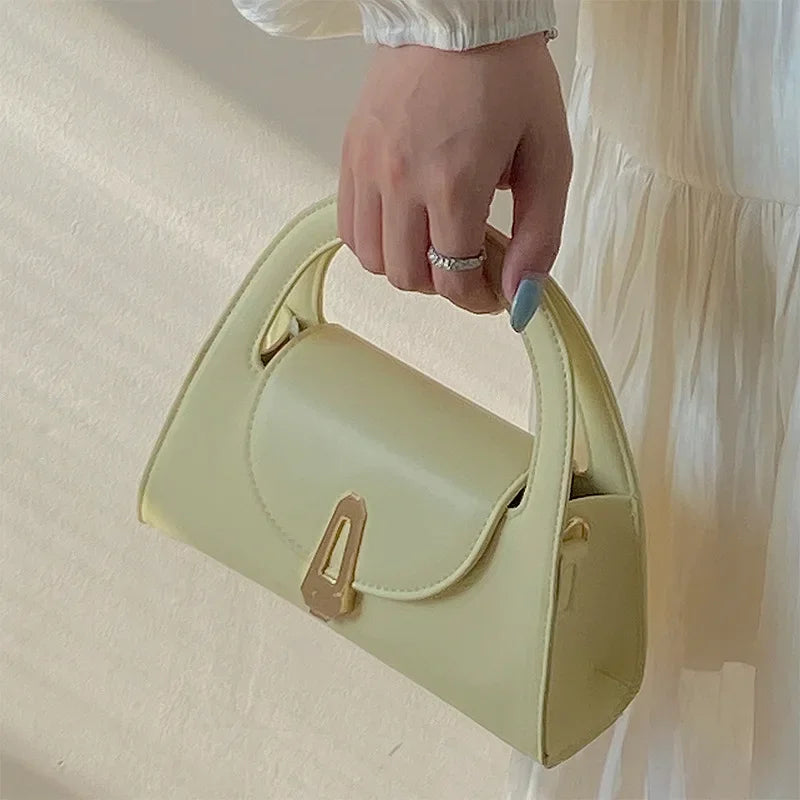 Niche high-end handbag women's new semi-round shoulder bag versatile commuter retro lock messenger bag tide