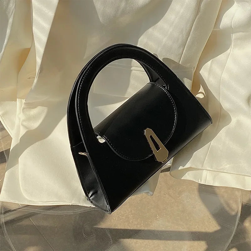 Niche high-end handbag women's new semi-round shoulder bag versatile commuter retro lock messenger bag tide