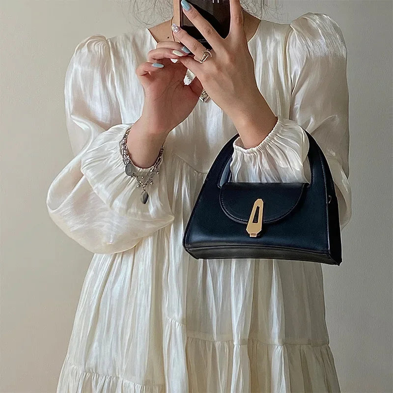 Niche high-end handbag women's new semi-round shoulder bag versatile commuter retro lock messenger bag tide