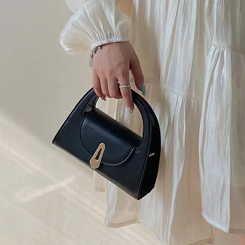 Niche high-end handbag women's new semi-round shoulder bag versatile commuter retro lock messenger bag tide